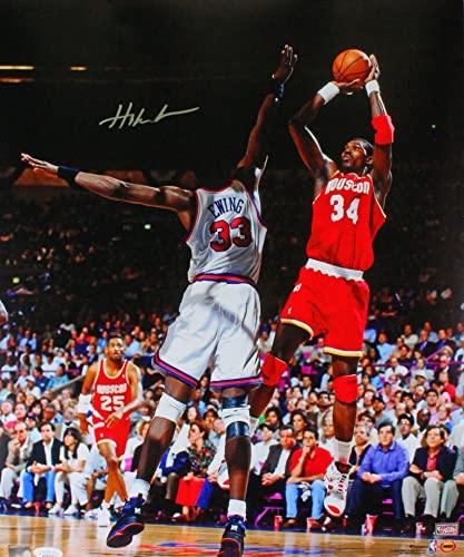 Hakeem Olajuwon Houston Rockets Autographed 16x20 Vs. Ewing Photo- JSA W Silver